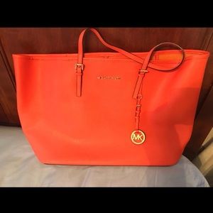 Michael Kors orange tote bag